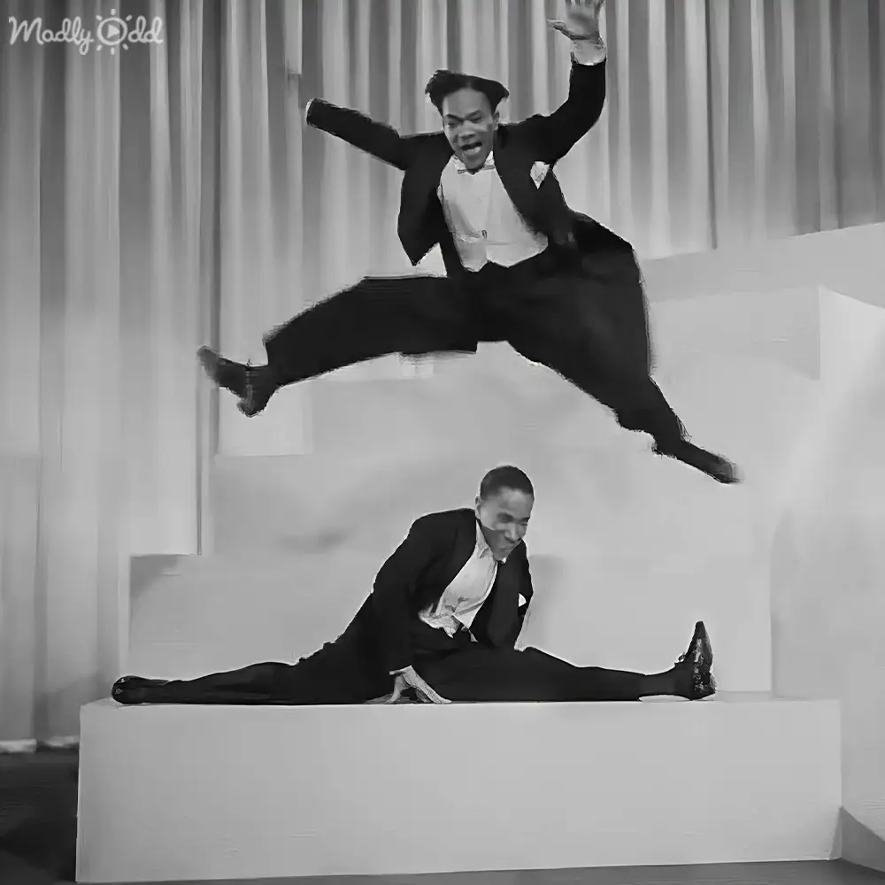 Elegant ballroom dance scene in old movie